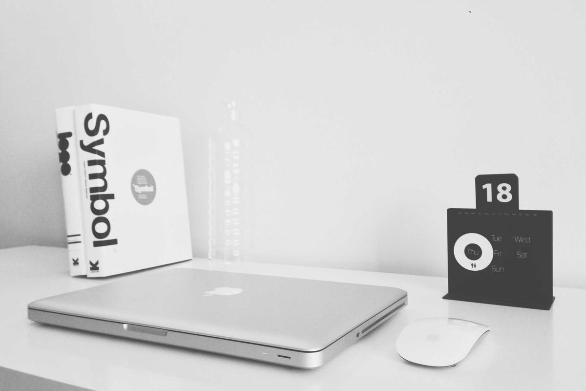 Notebook and writing materials for drafting a personal financial plan outline